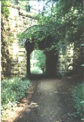 [Skew brickwork railway bridge over main footpath]